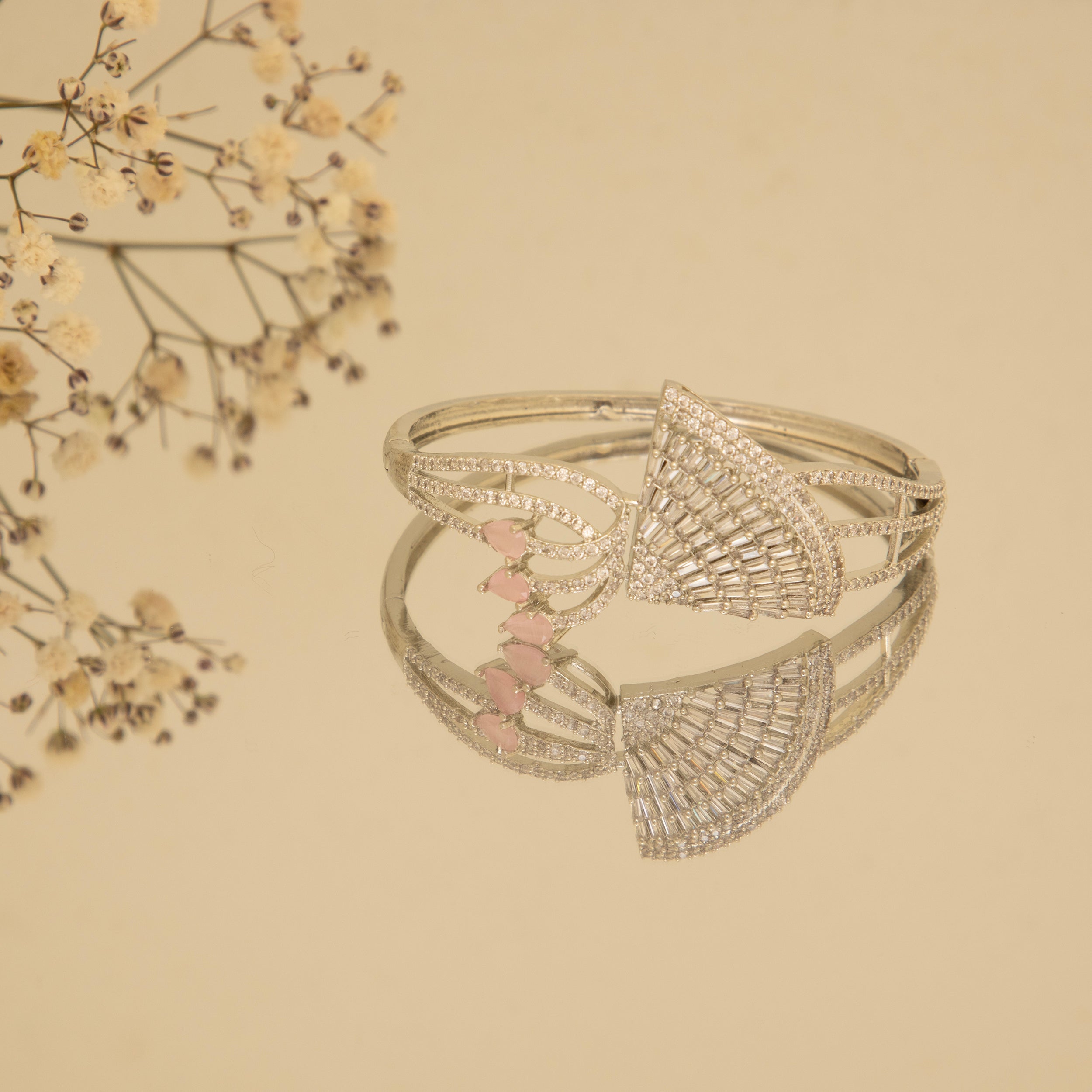 LA FILLE D'OR American Diamond and Pink stone Studded Bangle style bracelet.