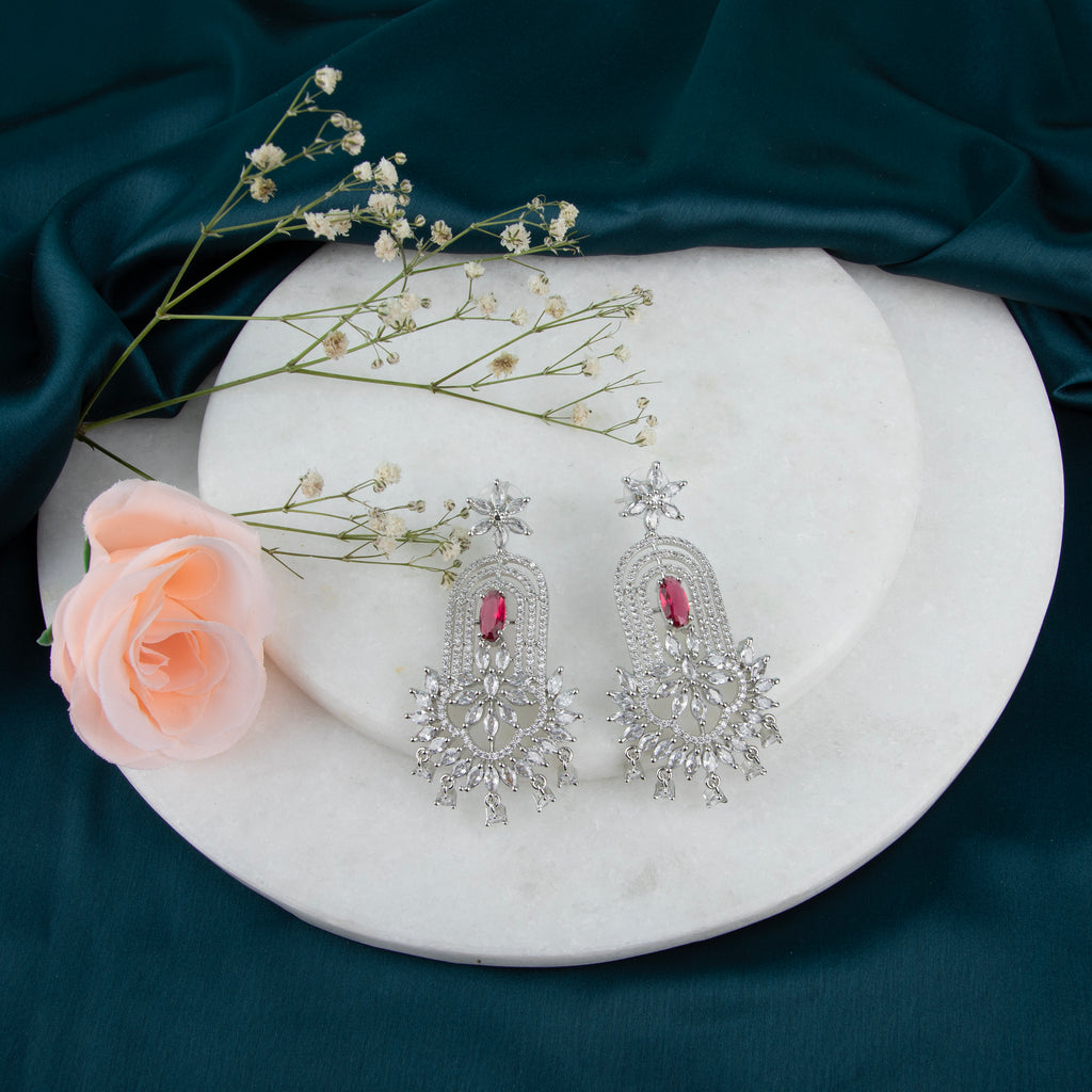 chandelier-style earrings with intricate detailing and a cascade of shimmering crystals.
