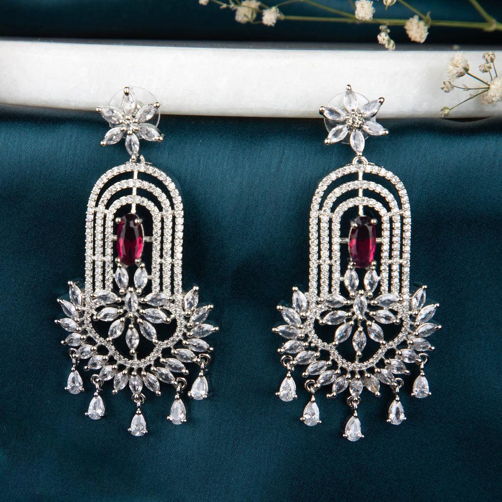 chandelier-style earrings with intricate detailing and a cascade of shimmering crystals.