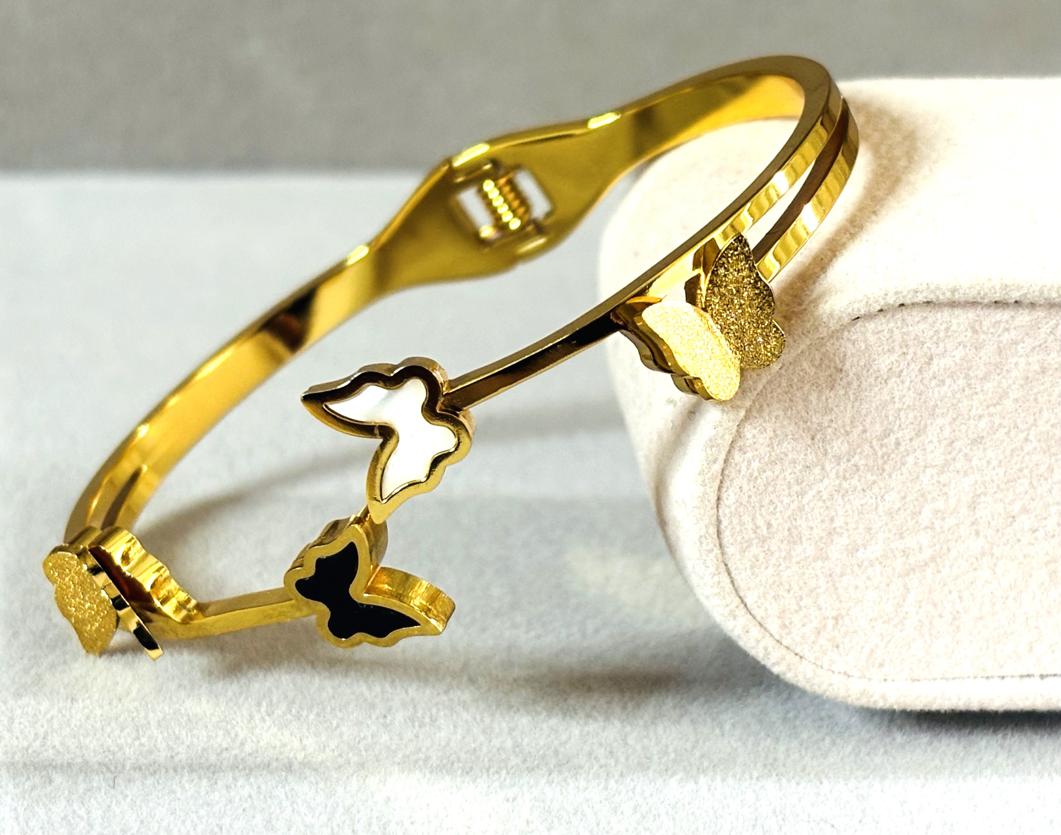 LA FILLE D'OR Gold-Plated Butterfly Bracelet with Black and White Enamel Design