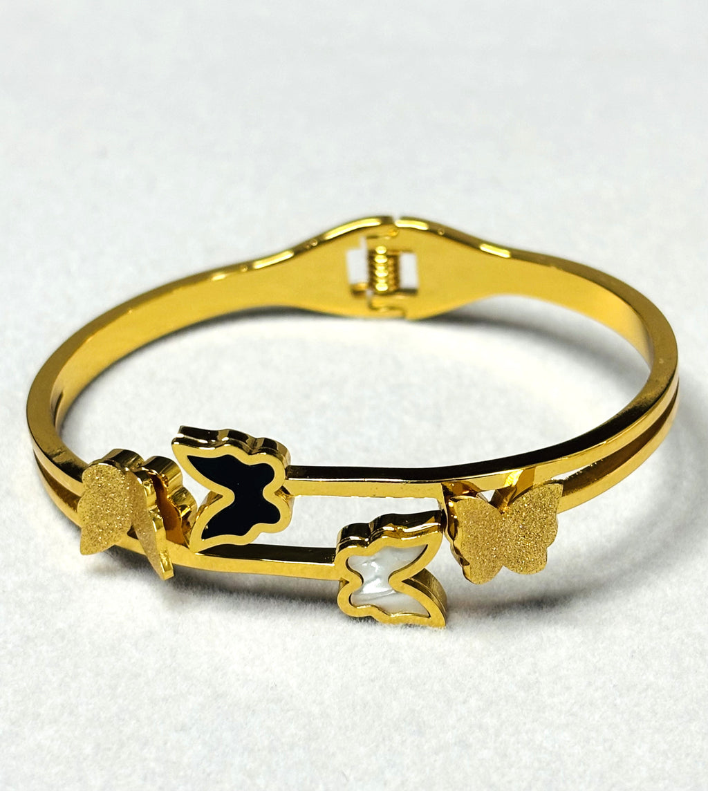 LA FILLE D'OR Gold-Plated Butterfly Bracelet with Black and White Enamel Design